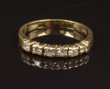 A 9ct gold ring set with cubic zirconia, size K, 1.8g
