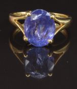 An 18ct gold ring set with an oval cut tanzanite, size K, 4.7g