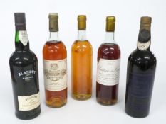 Five bottles of dessert and Madeira wines comprising Chateau Coutet Barsac 1976 73cl, Chateau des