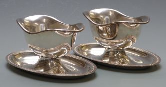 A pair of Christofle double ended gravy boats with integral underplates, height 10cm, length 23cm