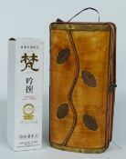 Bottle of Japanese Sake and presentation bottle of Tokaji Aszu 1995 white wine