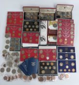 A collection of various Royal Mint coin sets including pre-decimal, together with Guernsey,