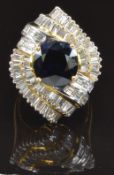 An 18ct gold metamorphic ring / pendant set with a round cut sapphire of approximately 2.2ct