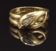 An 18ct gold snake ring set with two old cut diamonds, Birmingham 1919, size Q, 4.3g