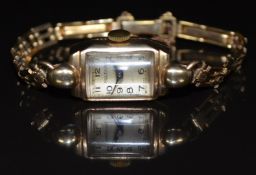 Rotary 9ct gold ladies wristwatch with blued hands, black Arabic numerals, silver dial and signed 15