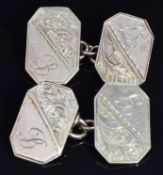 A pair of 9ct gold cufflinks with engraved scrolling decoration, 6.2g