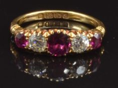 Edwardian 18ct gold ring set with cushion cut rubies and old cut diamonds (approx 0.2ct each),