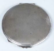Circular hallmarked silver compact with engine turned decoration, Birmingham 1950, diameter 8.5cm,