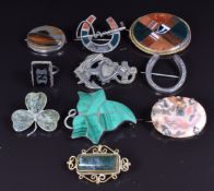 A collection of silver brooches including Victorian agate, Victorian malachite ivy, Connemara marble