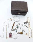 A collection of jewellery including Victorian silver brooch, Victorian locket, silver chains, silver