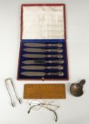 Cased set of hallmarked silver handled knives together with a pair of hallmarked silver sugar tongs,