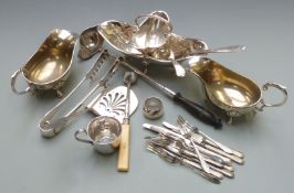 Collection of silver plated ware including asparagus tongs, double sided ladle with sieve, stilton