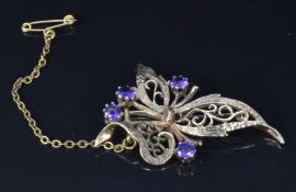 A 9ct gold brooch set with amethysts, 4.5cm, 5.9g