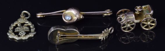 A 9ct gold brooch in the form of a shell set with a pearl, 9ct gold pendant / charm in the form of a