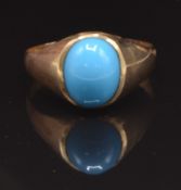 A yellow metal ring set with faux turquoise, size O, 2.7g