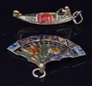 An 18ct gold charm in the form of a gondola, 1.2g, and a yellow metal charm in the form of a fan