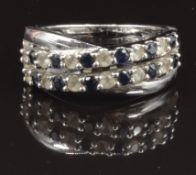A 9ct white gold ring set with sapphires and cubic zirconia, size O, 4.7g