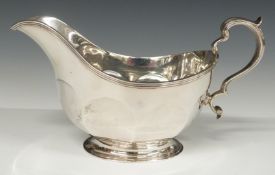 A hallmarked silver gravy boat, Birmingham 1931, maker Adie Brothers but with additional import