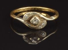 An 18ct gold ring set with diamonds in a twisted platinum setting, size S, 2.8g