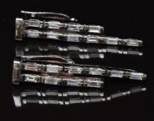 A pair of 18ct white gold earrings set with baguette cut diamonds, total diamond weight