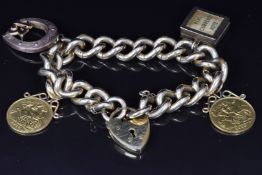 A bracelet with charms comprising two 1910 half gold sovereigns, a 9ct gold charm set with a 10