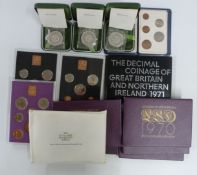 Three cased silver Royal Mint commemorative coins with certificates, together with ten UK proof sets