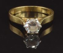 An 18ct gold ring set with a round brilliant cut diamond of approximately 0.6ct, size K, 2.9g