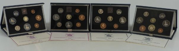 Royal Mint UK proof coin sets 1983, 1984, 1985 and 1986, in deluxe cases with certificates