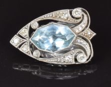A 9ct white gold c1920 clip set with a marquise mixed cut aquamarine and transitional cut