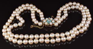 A double strand necklace of cultured pearls, the 9ct gold clasp set with turquoise and pearls