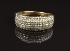 A 9ct gold ring set with four rows of diamonds, size O, 3.5g