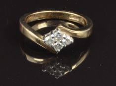 A 9ct gold ring set with four diamonds, size K, 3g