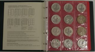 Lindner collector's album containing largely English crowns and 13 silver Britannias, George III and