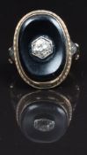 Victorian ring set with onyx and an old cut diamond of approximately 0.4ct, size L, 6g in Asprey