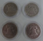 Four USA Liberty half dollars comprising two 1951, 1952 and 1957 examples