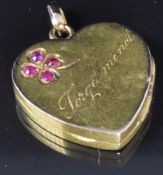 Edwardian locket set with rubies in a four leaf clover design, also engraved 'Forget me not',