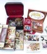A collection of costume jewellery including beads, brooches, etc