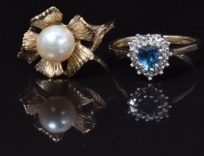 A 9ct gold ring set with a pearl and a 9ct gold ring set with a blue topaz and diamonds, 5g