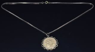 A 1958 gold full sovereign in 9ct gold mount, on 9ct gold chain, 17g