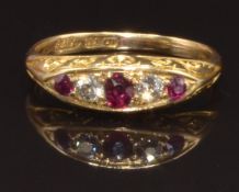 An early 20thC 18ct gold ring set with rubies and diamonds, size N, 3.5g