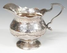 Cased Edward VII Mappin & Webb hallmarked silver Arts and Crafts jug with card cut and hammered