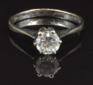 An 18ct white gold ring set with a round cut diamond of approximately 0.7ct, size Q, 2.9g