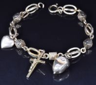 A 9ct gold charm bracelet, 11.3g