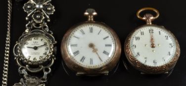 Two silver keyless winding open faced pocket watches, both with gold hands and engraved