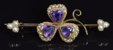 Edwardian brooch in the form of a shamrock set with heart shaped amethysts and seed pearls, 4 x 1.