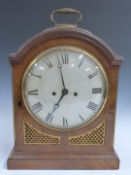 English Regency fusee mantel clock in arch topped flame mahogany case with gilt brass inset