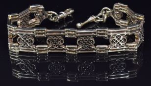 A 9ct gold watch chain/ bracelet made up of unusual pierced links, 30.7g