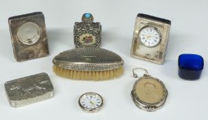 Two hallmarked silver mounted Kitney & Co. dressing table clocks, hallmarked silver mounted brush,
