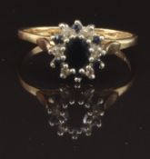 A 9ct gold ring set with sapphires and diamonds, size M, 2g