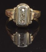 An Art Deco 18ct gold ring set with three rose cut diamonds, size K, 1.9g